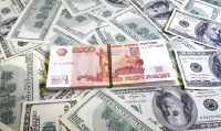 Рубль вырос по отношению к доллару и евро